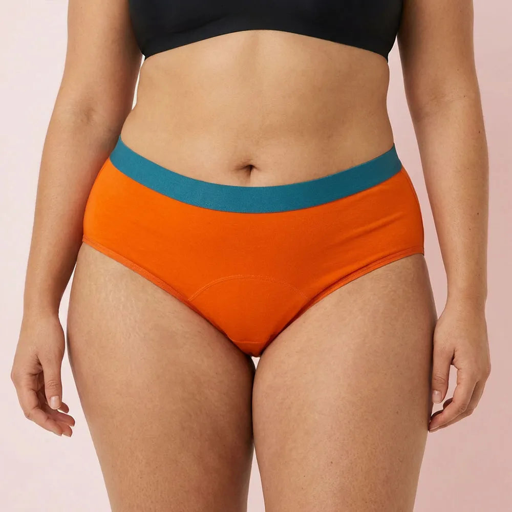 Woman wearing orange Color Flex Leakproof Underwear with smooth fit